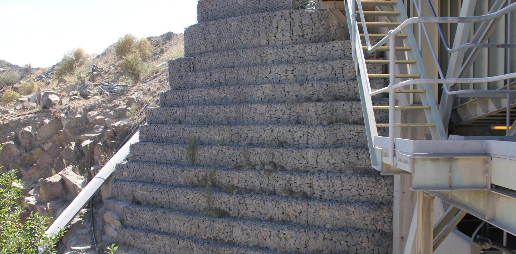 Gabion faced wall supports heavy loads act quarry 1690X831